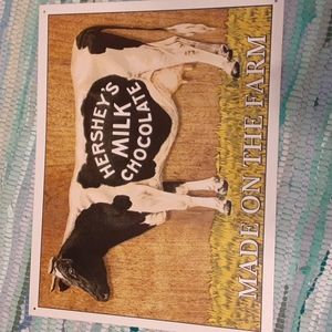 Three tin rustic Hershey signs